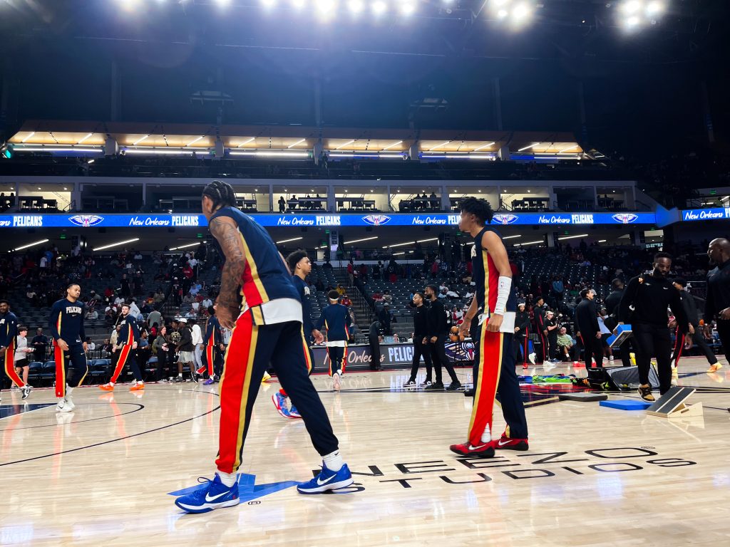 NEEZO Studios logo featured on court during New Orleans Pelicans vs Houston Rockets preseason NBA game in Birmingham, Alabama