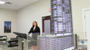 Interactive real estate sales platform LiveSite® used on a touchscreen in a sales gallery, integrated with a physical scale model by NEEZO Studios