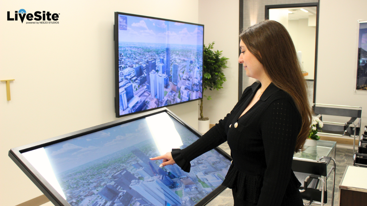 LiveSite® Interactive real-time 3d real estate sales software LiveSite® being used on a touchscreen in a luxury condo sales gallery digital twin experience