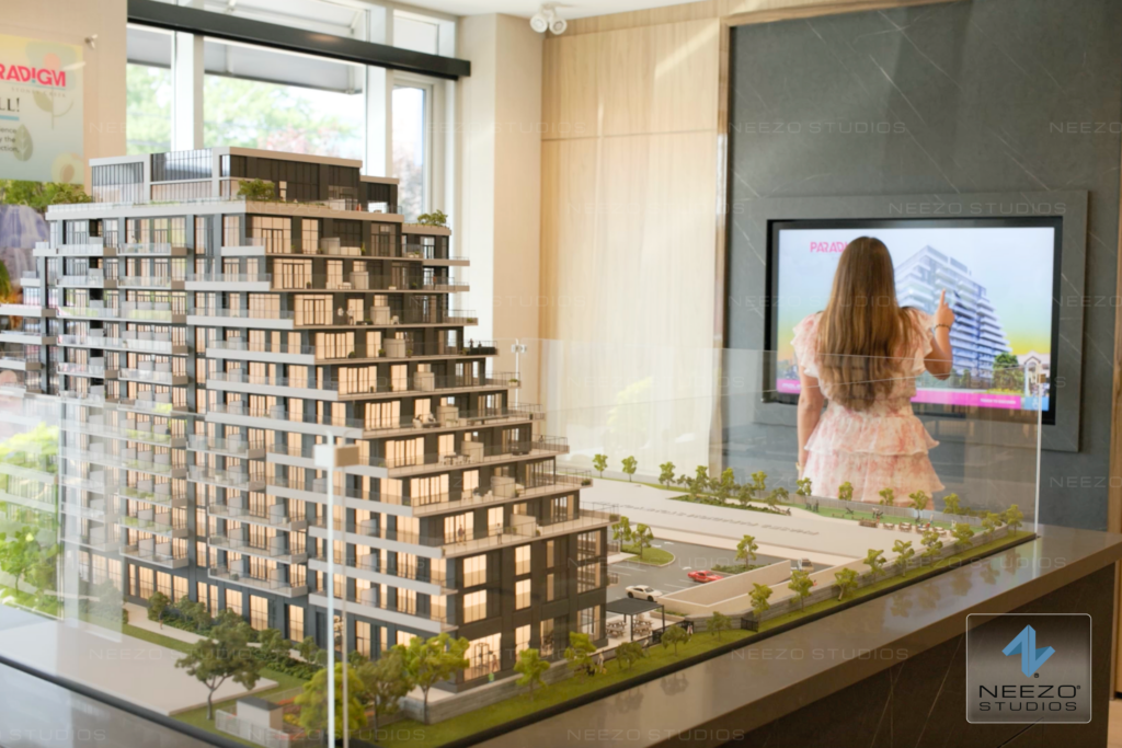 Integrated architectural scale model and LiveSite® Community 3D sales gallery software by NEEZO Studios for Paradigm Stoney Creek presentation center